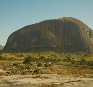 Iconic Zuma Rock with its stunning natural beauty in Abuja, Nigeria, stands majestically under the clear sky.
